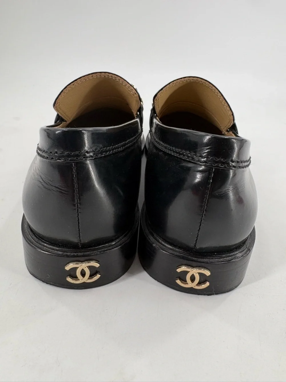 CHANEL Black Leather Loafers with Gold Logo Chain